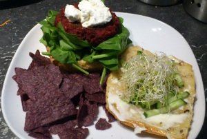 Beetroot burger, with spinach, cucumber, sprouts & goat cheese.